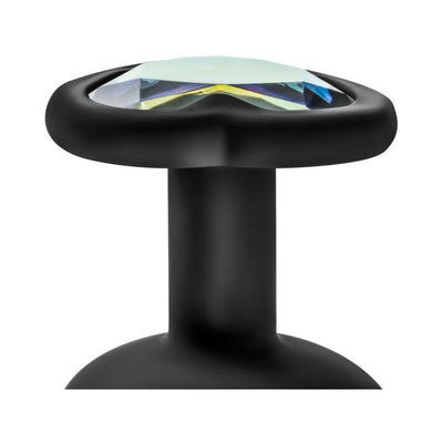 Close-up of black silicone plug base with heart shape and white gem detail on top