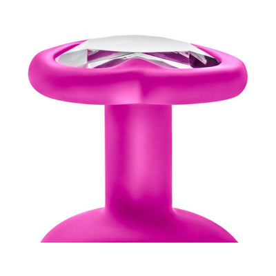 Close-up of pink silicone plug base with white gem heart-shaped accent from Luxe 3-piece bling plug training kit