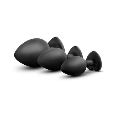 Three black silicone tapered plugs in small, medium, and large sizes with heart-shaped bases, shown on white background.