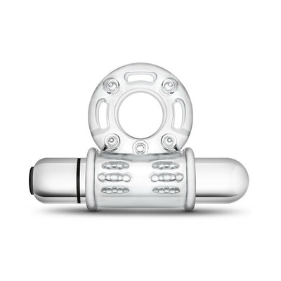 Clear vibrating bull ring cock ring with textured sleeve and removable bullet vibrator on white background.