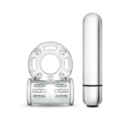 Clear vibrating bull ring cock ring with textured sleeve and silver bullet vibrator accessory side by side on white background.