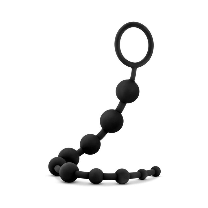 Black silicone anal beads with graduated spheres and a loop handle for easy removal.