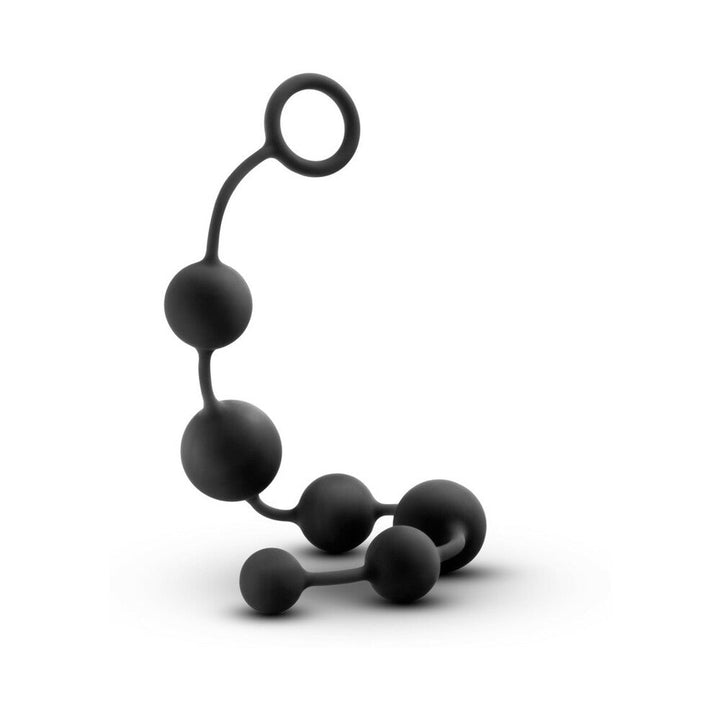 Large black silicone anal beads with graduated spheres and a loop handle for easy removal.