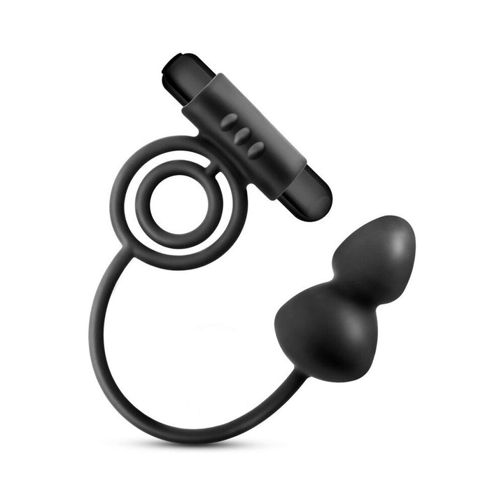 Black silicone anal plug with attached vibrating C-ring and bullet vibrator detail on white background.