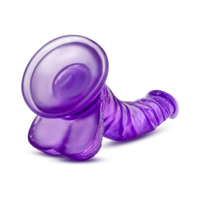 Purple realistic dildo with strong suction cup base, curved design, and textured surface for versatile use.