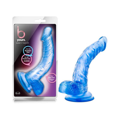 Purple translucent realistic dildo with suction cup base shown next to its packaging on a white background.
