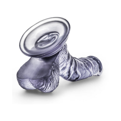 Purple translucent realistic dildo with suction cup base and textured design for targeted stimulation.