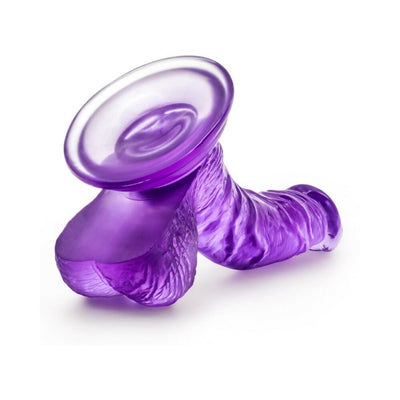 Purple realistic curved dildo with suction cup base and textured design for targeted stimulation.