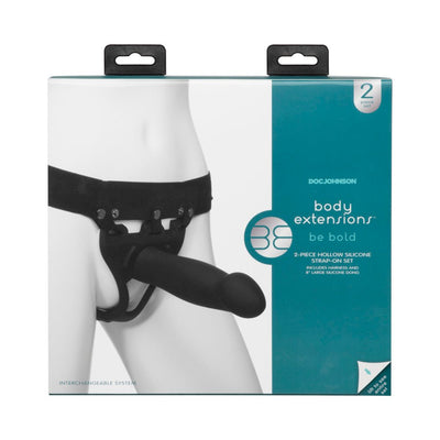 Packaging of Doc Johnson Body Extensions Be Bold 2-piece hollow silicone strap-on set with adjustable harness and large attachment.