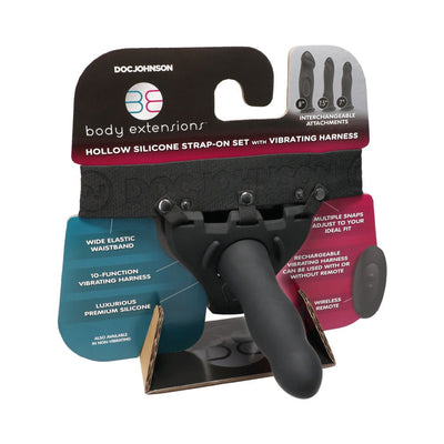 Doc Johnson Body Extensions hollow silicone strap-on set with vibrating harness and interchangeable attachments in black packaging.