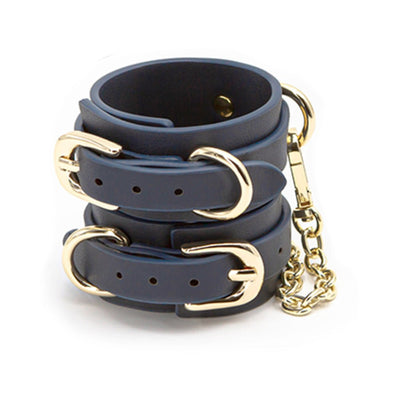 Blue synthetic leather wrist cuffs with gold-tone buckles and connecting chain detail.