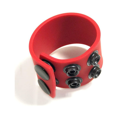 Red silicone adjustable ball stretcher with black snap closures for customizable fit and comfort.