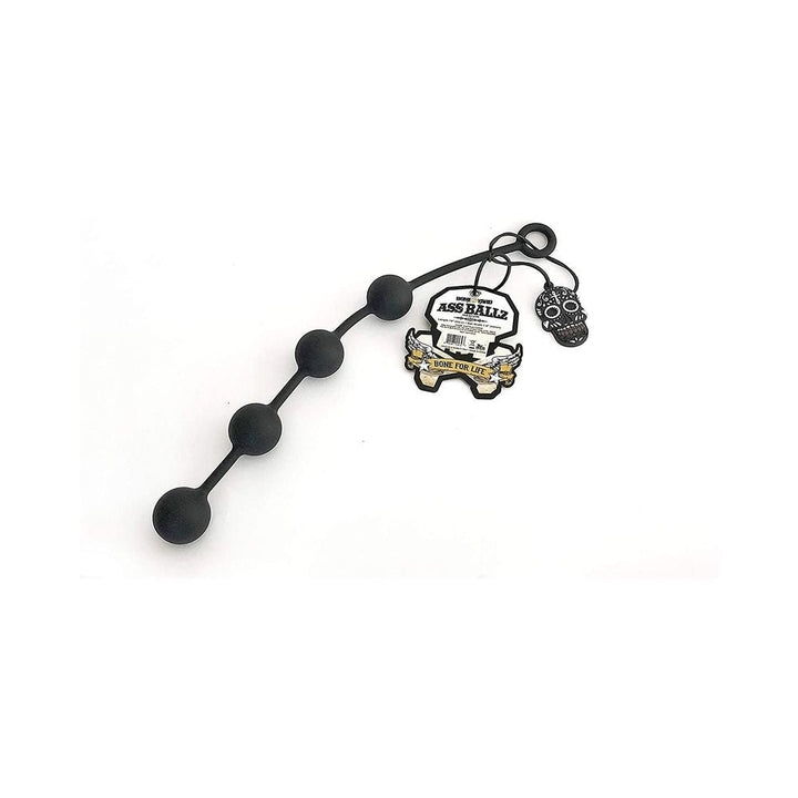 Black silicone anal beads with four graduated balls and a ring handle, featuring branded tags and a decorative skull charm.