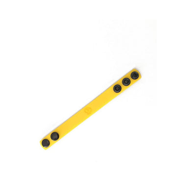 Yellow silicone adjustable strap with black snap buttons on white background