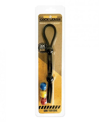 Black adjustable double cock leash with color-coded ABS latches in retail packaging on a brown background.