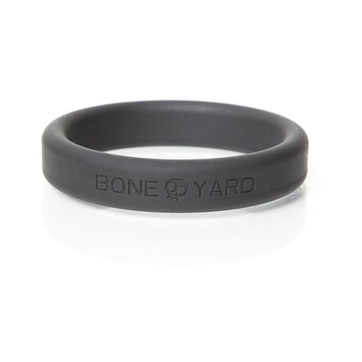 Black silicone Boneyard cock ring with embossed logo and smooth finish, 2-inch size.
