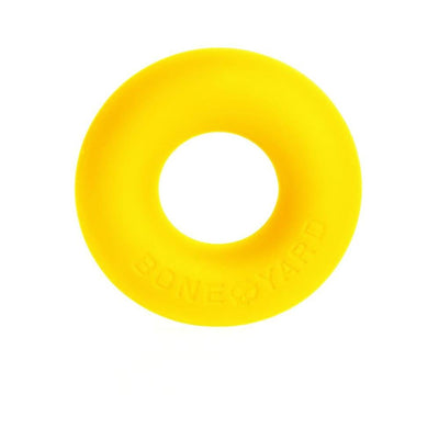 Bright yellow silicone ring with Boneyard branding, smooth texture and donut shape.