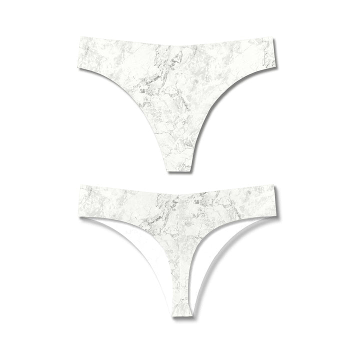 Seamless thong underwear with a white and gray marble print, shown from front and back views on a white background.