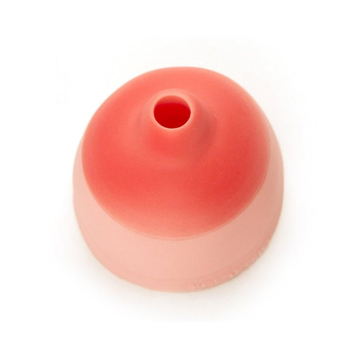 Pink silicone beer can topper with a small drinking hole, designed for easy attachment to beverage cans.