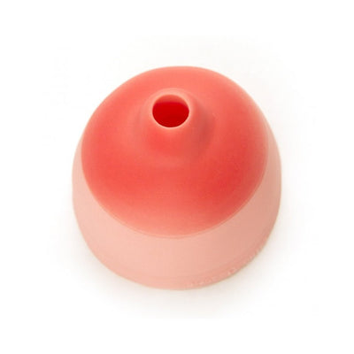 Pink silicone beer can topper with a small drinking hole, designed for easy attachment to beverage cans.