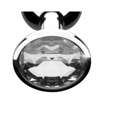 Medium-sized clear gem anal plug with polished metal finish and faceted crystal base detail.