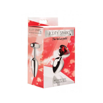 Packaging box of Booty Sparks small metal anal plug with red heart-shaped gem on base against a red and white background.