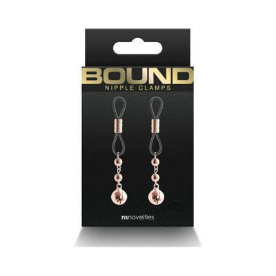 Rose gold adjustable Bound D1 nipple clamps with silicone loops on black packaging by NS Novelties.