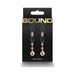 Rose gold adjustable Bound D1 nipple clamps with silicone loops on black packaging by NS Novelties.