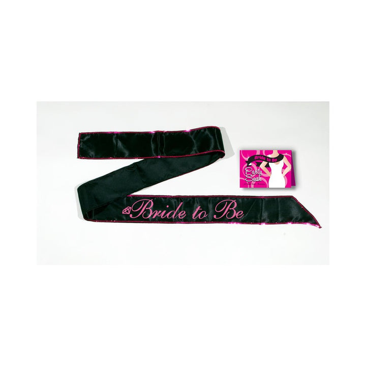 Black satin Bride to Be sash with pink lettering and trim, displayed with pink and black packaging card.