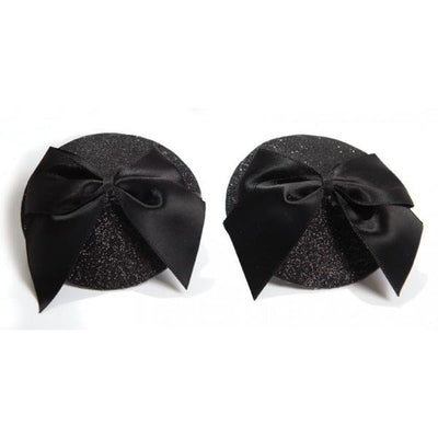 Black glittery round pasties adorned with large satin bows for a glamorous burlesque look.
