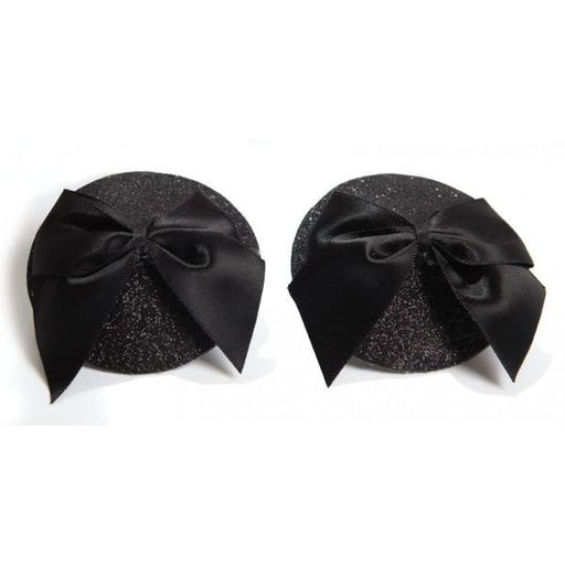Black glittery round pasties adorned with large satin bows for a glamorous burlesque look.