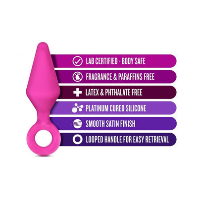 Small pink silicone plug with looped handle and text highlighting body-safe, fragrance-free, latex-free, and smooth satin finish features.