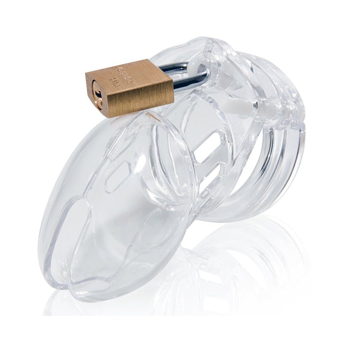 Clear medical-grade polycarbonate male chastity device with brass padlock and vented design for comfort and hygiene.