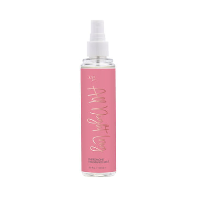 Clear spray bottle with pink label reading All Night Long pheromone fragrance mist 3.5 fl oz
