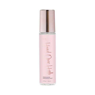 Cgc Head Over Heels pheromone fragrance mist in a pink bottle with rose gold cap and lettering, 3.5 oz size.
