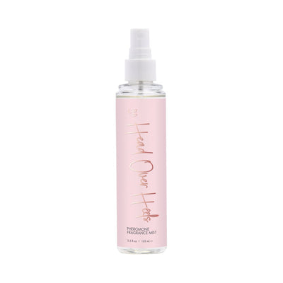 Cgc Head Over Heels pheromone fragrance mist in a clear bottle with a soft pink label and white spray cap.