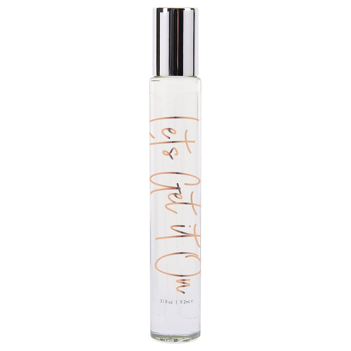 Clear glass rollerball bottle of Cgc Lets Get It On perfume oil with silver cap and peach script lettering.