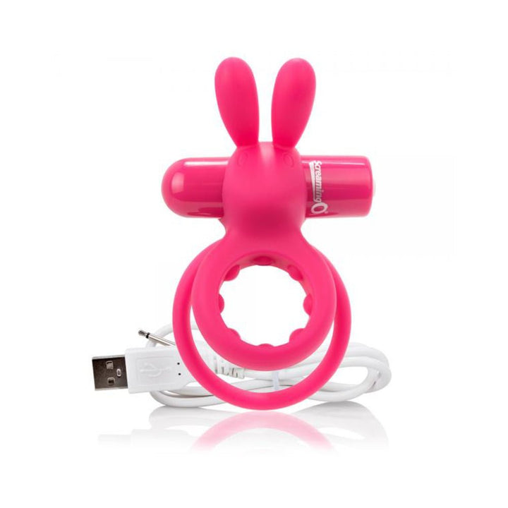 Pink silicone rabbit-shaped mini vibrator with dual rings and USB charging cable on white background.