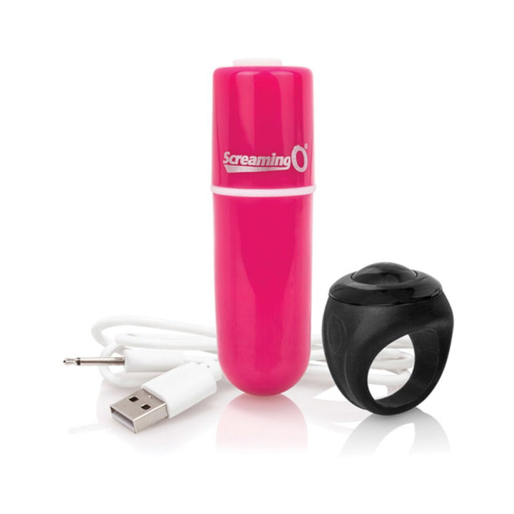 Pink bullet vibrator with USB charging cable and black remote control ring on white background.