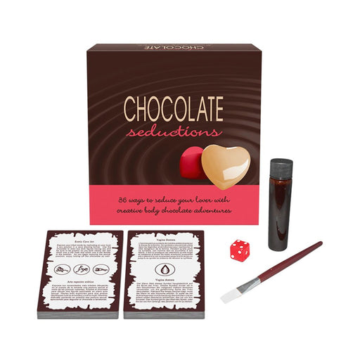 Chocolate Seductions kit with body chocolate bottle, brush, red die, two seduction cards, and box packaging.