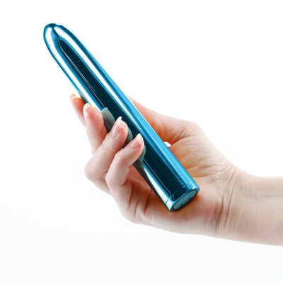 Hand holding a sleek, metallic blue 7-inch rechargeable vibrator with a smooth, rounded design.
