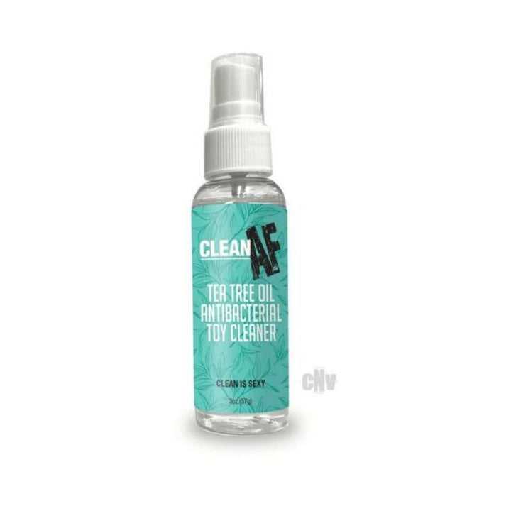 2 oz clear spray bottle of Clean AF Tea Tree Oil Antibacterial Toy Cleaner with teal label and white spray cap