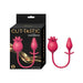 Pink silicone Clit-Tastic Tulip finger massager and pleasure plug with dual ends and flexible connecting cord next to its black and gold packaging.