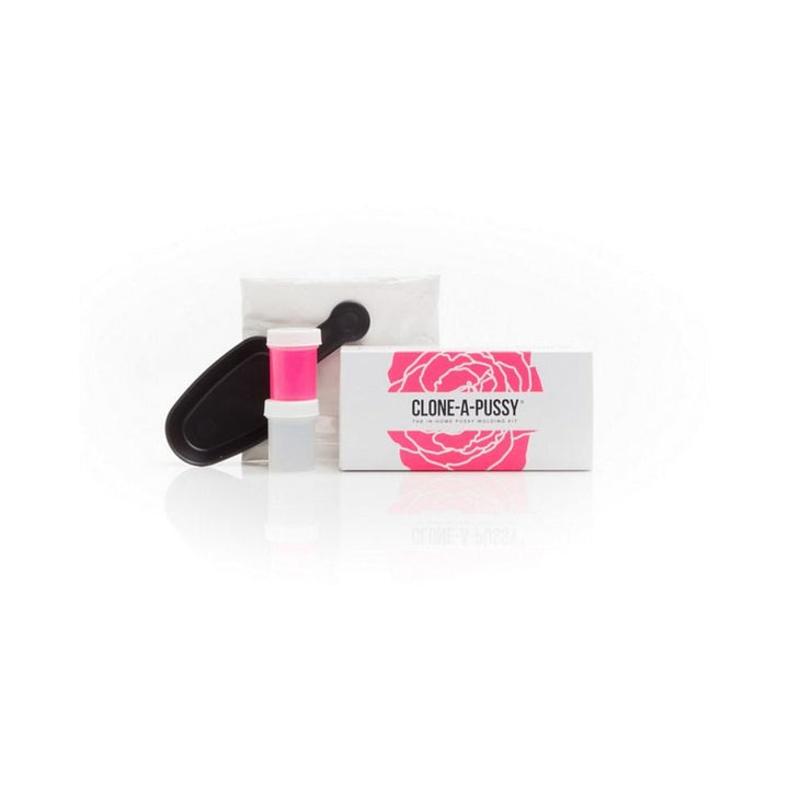 Clone-A-Pussy Kit with hot pink silicone, black molding container, algae-based molding powder, and packaging box with floral design.