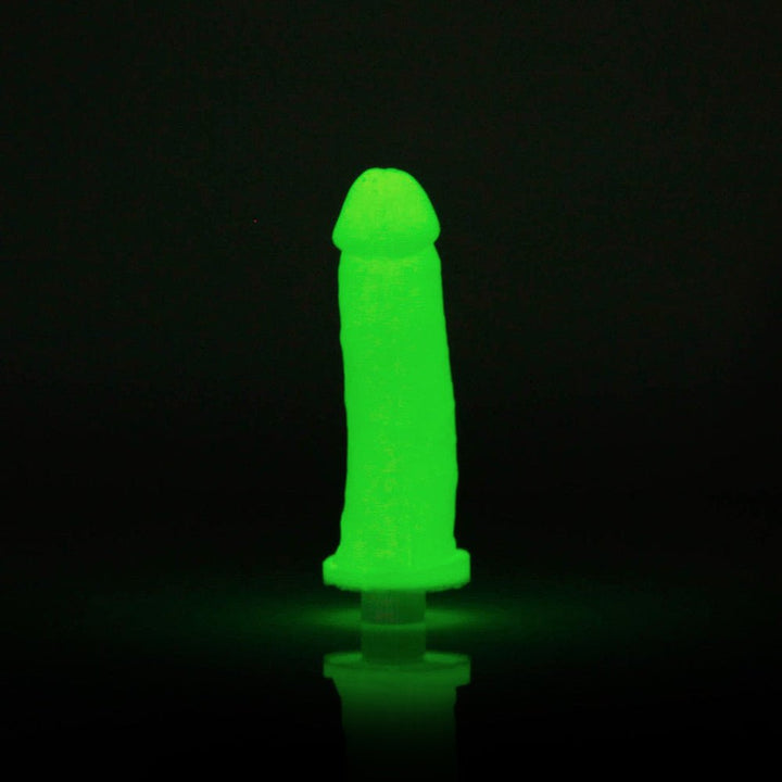 Glow-in-the-dark silicone vibrating toy shaped like a realistic phallic replica against a black background.