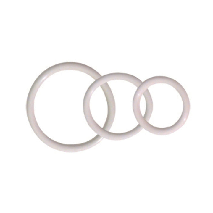 Set of three soft white cock rings in varying sizes arranged on a white background.