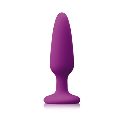 Small purple silicone plug with tapered tip and suction cup base for secure, hands-free use.