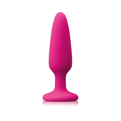 Small purple silicone plug with tapered tip and suction cup base for secure, hands-free use.