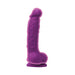 Purple dual density dildo with realistic texture and suction base standing upright on white background.
