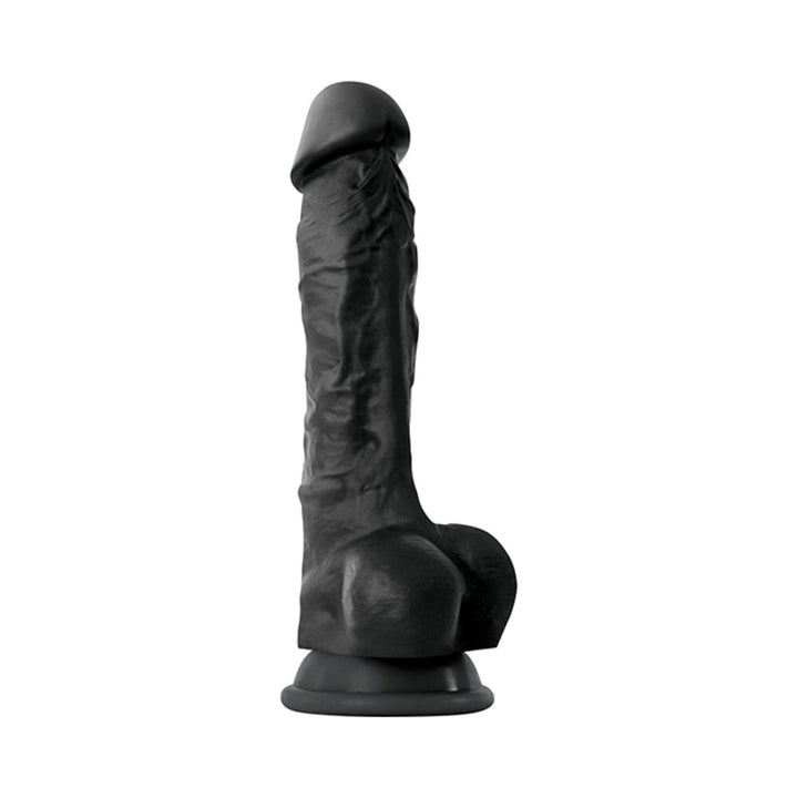 Black realistic silicone dildo with suction cup base, detailed texture and lifelike design, standing upright on white background.